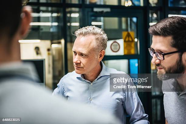 portrait of a manager during a business meeting - herstellendes gewerbe stock-fotos und bilder