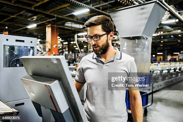 engineer on a control panel in factory - paper industry stock-fotos und bilder