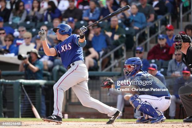 Doug Bernier of the Texas Rangers bats against the Kansas City Royals during the spring training game at Surprise Stadium on February 26, 2017 in...