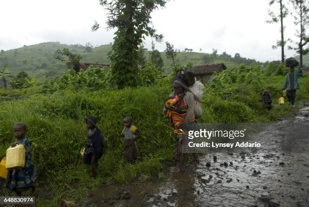 Congolese villagers flee fighting as the Congolese Army leads an offensive against rebel soldiers under Laurent Nkunda's rebel forces near Sake,...