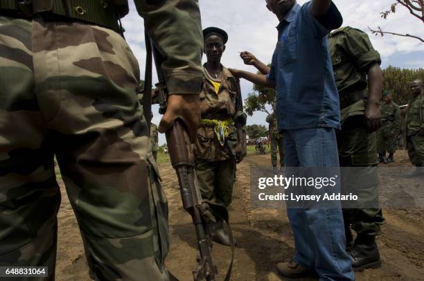 Four soldiers with the Rally for Unity Democracy, RUD, a dissident faction of the Rwandan-led Hutu militia known as the FDLR, surrender to U.N. And...