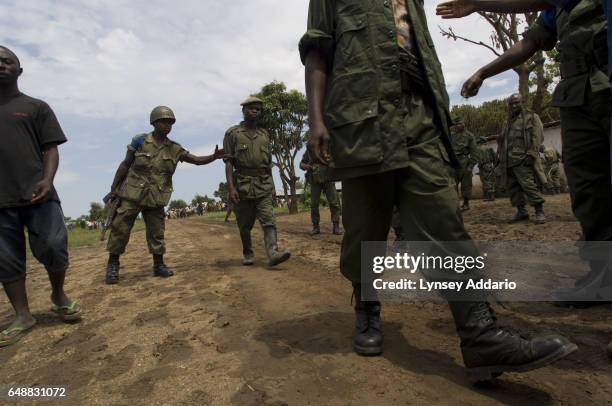 Four soldiers with the Rally for Unity Democracy, RUD, a dissident faction of the Rwandan-led Hutu militia known as the FDLR, surrender to U.N. And...