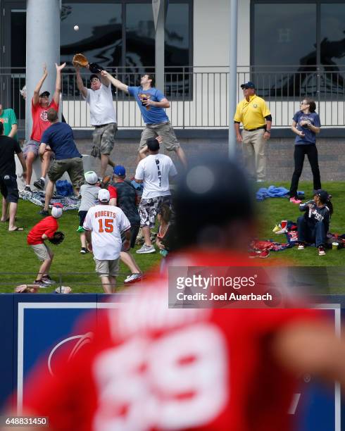 Sam Travis of the Boston Red Sox watches fans catch his three run home run ball in left field against the Houston Astros in the third inning during a...