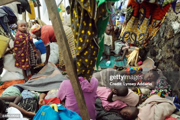 Congolese families, displaced from the villages of Rugari, Kiwanga, and those around Rutshuru, awake at dawn in a group of tents in Don Bosco, a...
