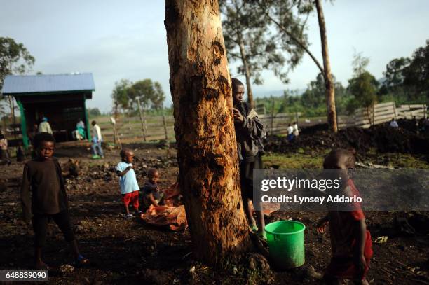 Congolese children, displaced from the villages of Rugari, Kiwanga, and those around Rutshuru, walk around Don Bosco, a school near a base belonging...