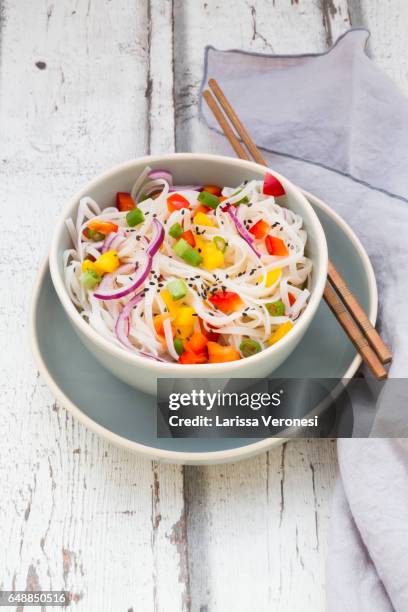 bowl of glass noodle salad with vegetables on wood - rice noodles stock pictures, royalty-free photos & images