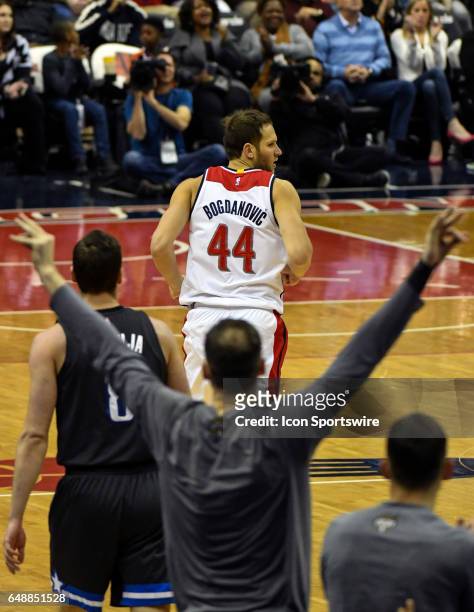 Washington Wizards forward Jason Smith celebrates after a three point basket by guard Bojan Bogdanovic in the first half against the Orlando Magic on...