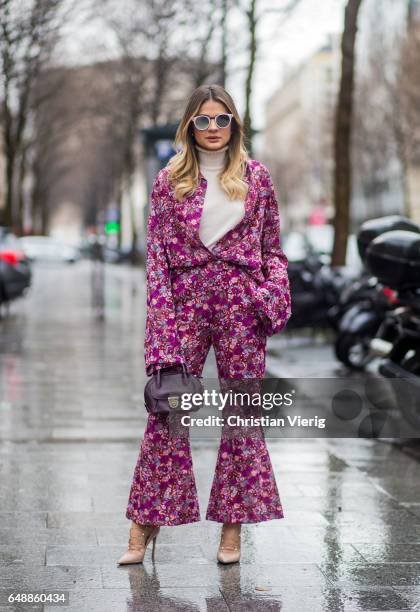 Thassia Naves wearing an overall with floral print outside Giambattista Valli on March 6, 2017 in Paris, France.