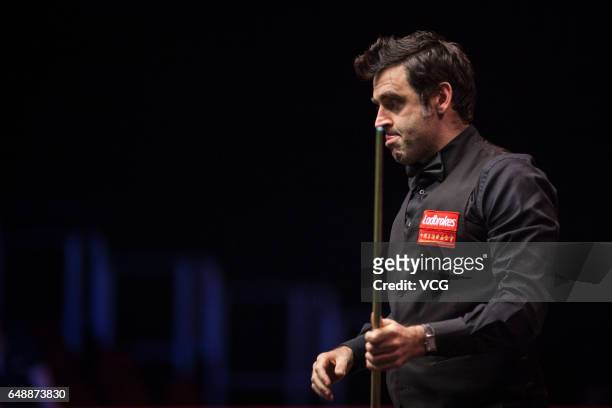 Ronnie O'Sullivan of England reacts during the first round match against Liang Wenbo of China on day one of 2017 Ladbrokes Players Championship at...