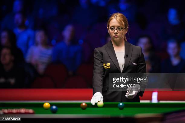 Referee Desislava Bozhilova positions a ball during the first round match between Stuart Bingham of England and Anthony Hamilton of England on day...