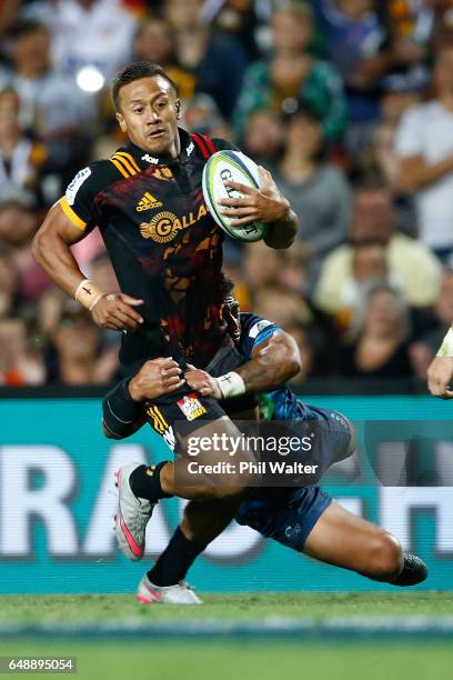 Tim Nanai-Williams of the Chiefs is tackled during the round two Super Rugby match between the Chiefs and the Blues at Rugby Park on March 3, 2017 in...