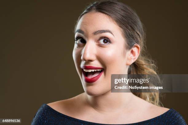 eureka. beautiful pin up girl with red lipstick. - raised eyebrows stock pictures, royalty-free photos & images