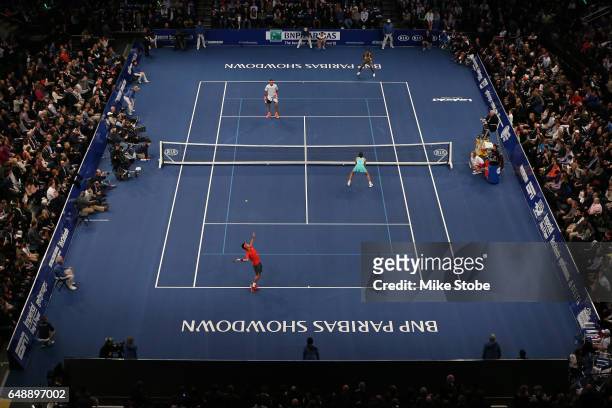 Garbine Muguruza and Kei Nishikori of Team World play during their Mixed Doubles match against Venus WIlliams and Juan Martin del Potro of Team...