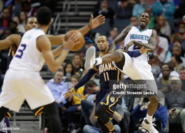 Monta Ellis of the Indiana Pacers tries to stop Marvin Williams of the Charlotte Hornets from getting a pass during their game at Spectrum Center on...