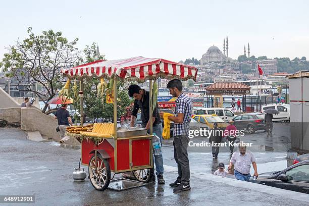 corn vendor and suleymaniye mosque in the back - corncob towers stock pictures, royalty-free photos & images