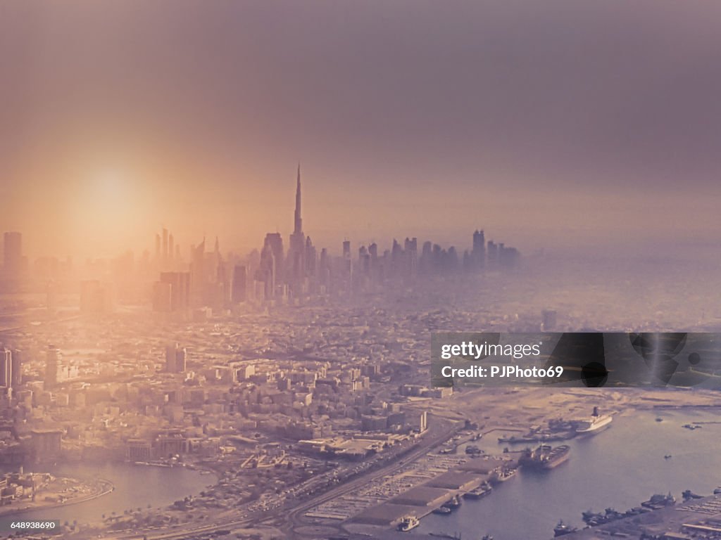 Aerial view of Dubai with some fog at sunset