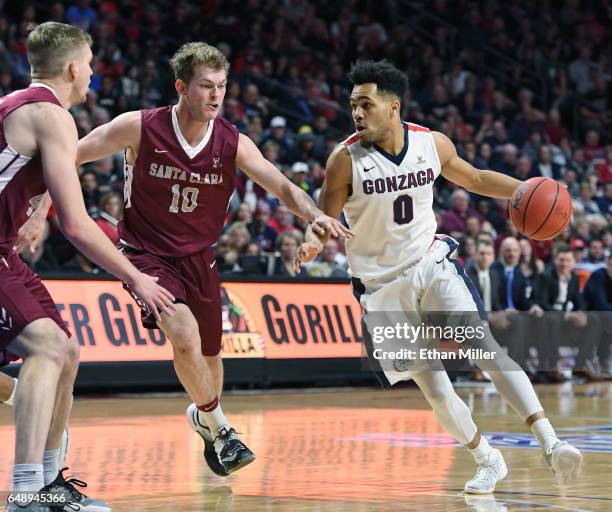 Silas Melson of the Gonzaga Bulldogs drives against Kai Healy of the Santa Clara Broncos during a semifinal game of the West Coast Conference...