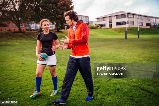 advice from her rugby coach - rugby sport stock pictures, royalty-free photos & images