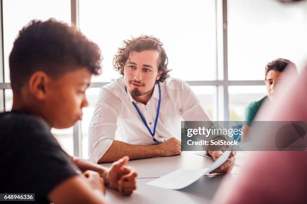 helping his student with the school work - learning difficulty stock pictures, royalty-free photos & images