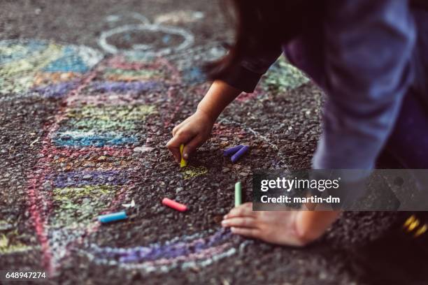 kid painting on the ground - children and art stock pictures, royalty-free photos & images