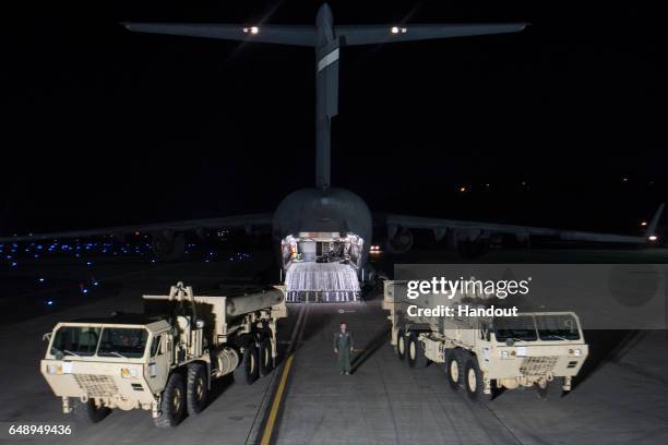 In this handout photo provided by U.S. Forces Korea, trucks are seen carrying parts required to set up the Terminal High Altitude Area Defense...