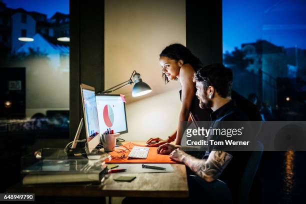 creative new business people working late on a computer - business partner light stock-fotos und bilder
