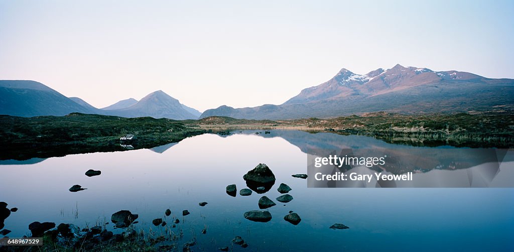Cuillin mountain range reflected in a Loch