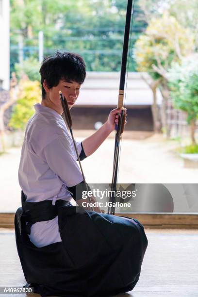 young trainee archer - kyudo stock pictures, royalty-free photos & images