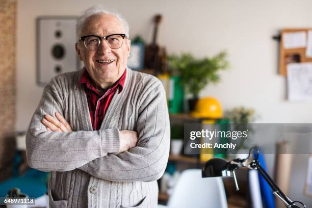 smiling active senior with arms crossed - portrait senior stock pictures, royalty-free photos & images