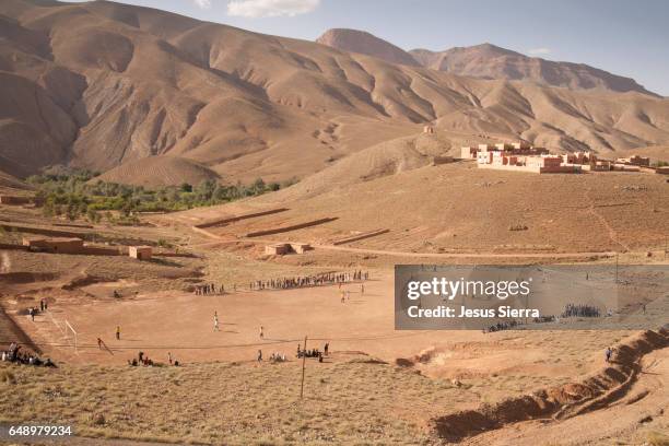 football field in dades valley, morocco. - imilchil stock-fotos und bilder