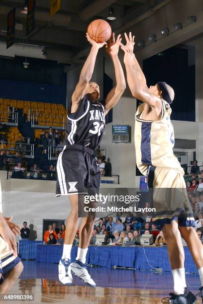 David West of the Xavier Musketeers takes a shot during a college basketball game against the George Washington Colonials at the Smith Center on...