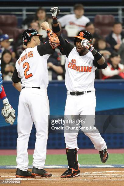 Jurickson Profar of the Netherlands celebrates at home after hitting a two-run homerun in the first inning during the World Baseball Classic Pool A...