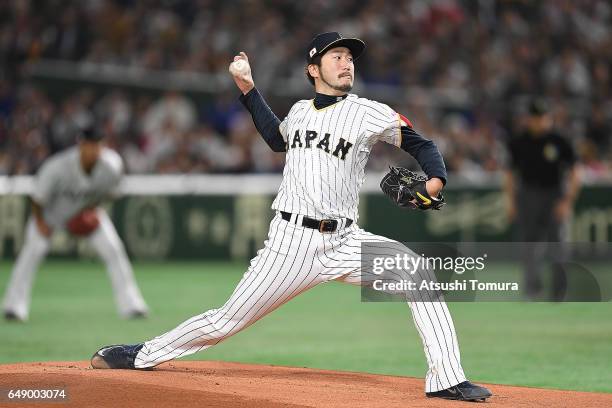Ayumu Ishikawa of Japan pitches in the first inning of the World Baseball Classic Pool B Game One between Cuba and Japan at Tokyo Dome on March 7,...