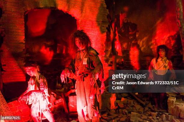 Diorama depicting victims of the Atomic Bomb blast in an inferno and ruins of Hiroshima.