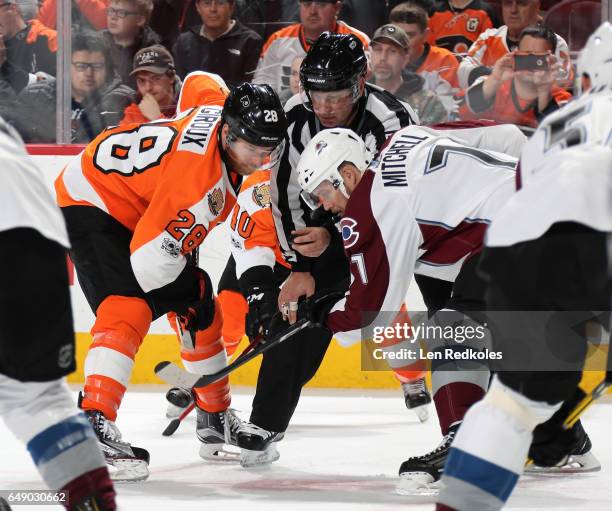 Claude Giroux of the Philadelphia Flyers prepares to face-off against John Mitchell of the Colorado Avalanche on February 28, 2017 at the Wells Fargo...