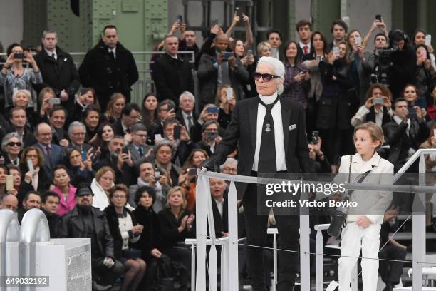 Karl Lagerfeld and Hudson Kroenig walk the runway during the finale of the Chanel show as part of the Paris Fashion Week Womenswear Fall/Winter...