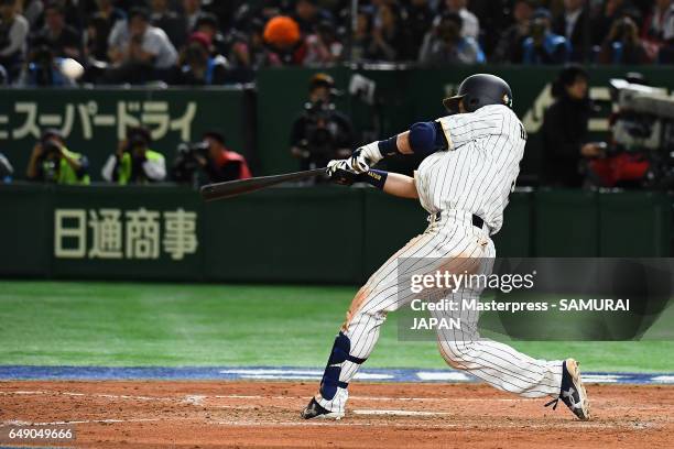 Infielder Nobuhiro Matsuda of Japan hits a three-run homer to make it 1-6 in the bottom of the fifth inning during the World Baseball Classic Pool B...