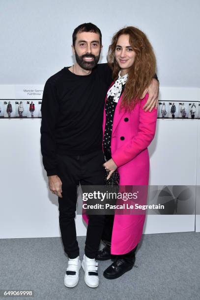 Giambattista Valli and Alexia Niedzelski attend the Moncler Gamme Rouge show as part of the Paris Fashion Week Womenswear Fall/Winter 2017/2018 on...
