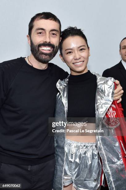 Giambattista Valli and a guest attend the Moncler Gamme Rouge show as part of the Paris Fashion Week Womenswear Fall/Winter 2017/2018 on March 7,...