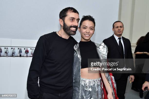 Giambattista Valli and a guest attend the Moncler Gamme Rouge show as part of the Paris Fashion Week Womenswear Fall/Winter 2017/2018 on March 7,...