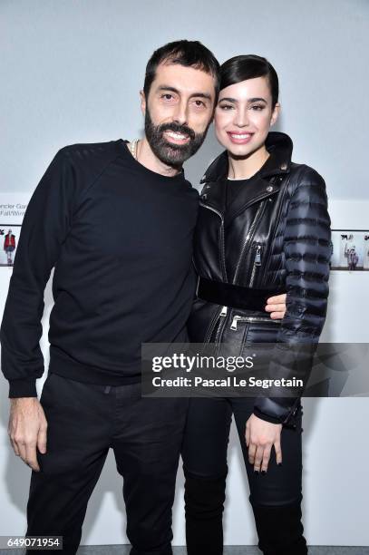 Giambattista Valli and Sofia Carson attend the Moncler Gamme Rouge show as part of the Paris Fashion Week Womenswear Fall/Winter 2017/2018 on March...
