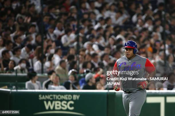 Outfielder Alfredo Despaigne of Cuba runs after hitting a solo homer to make it 2-7 in the top of the seventh inning during the World Baseball...