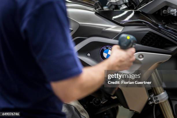 Mechanic during the assembly of a motorcycle at the BMW plant in Berlin on February 21, 2017 in Berlin, Germany.