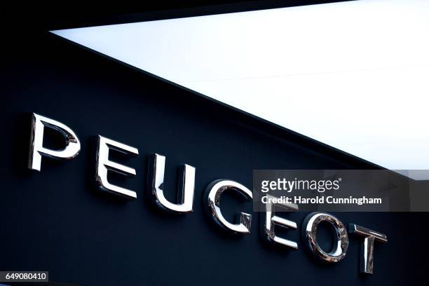 Peugeot logo is shown during the 87th Geneva International Motor Show on March 7, 2017 in Geneva, Switzerland. The International Motor Show showcases...