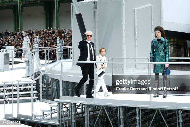Stylist Karl Lagerfeld and his Godson Hudson Kroenig acknowledge the applause of the audience at the end of the Chanel show as part of the Paris...