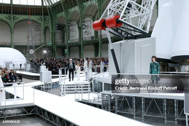 Stylist Karl Lagerfeld and his Godson Hudson Kroenig acknowledge the applause of the audience at the end of the Chanel show as part of the Paris...