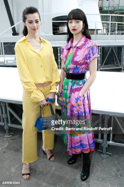 Ayami Nakajo and Nana Komatsu attend the Chanel show as part of the Paris Fashion Week Womenswear Fall/Winter 2017/2018 on March 7, 2017 in Paris,...