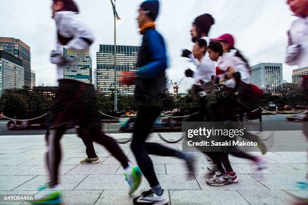 joggers around imperial palace - multiple exposure sports stock pictures, royalty-free photos & images