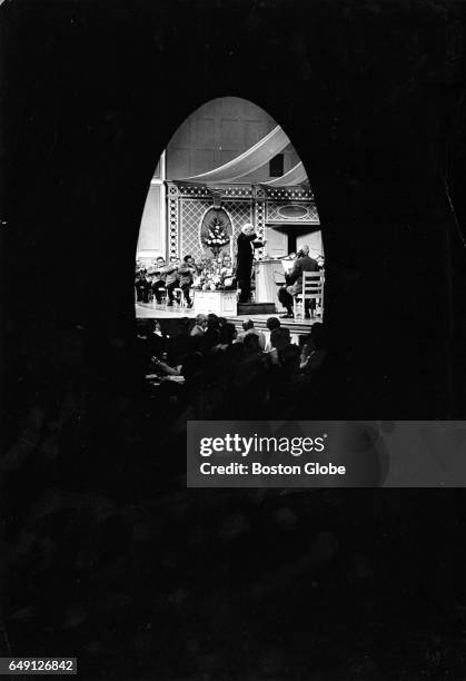 Conductor Arthur Fiedler leads the Boston Pops as they perform at Symphony Hall in Boston on May 22, 1970.
