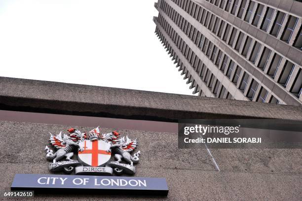 The heraldic achievement of the City of London is seen at the Barbican in London on March 1, 2017. Britain's Finance minister Philip Hammond earlier...